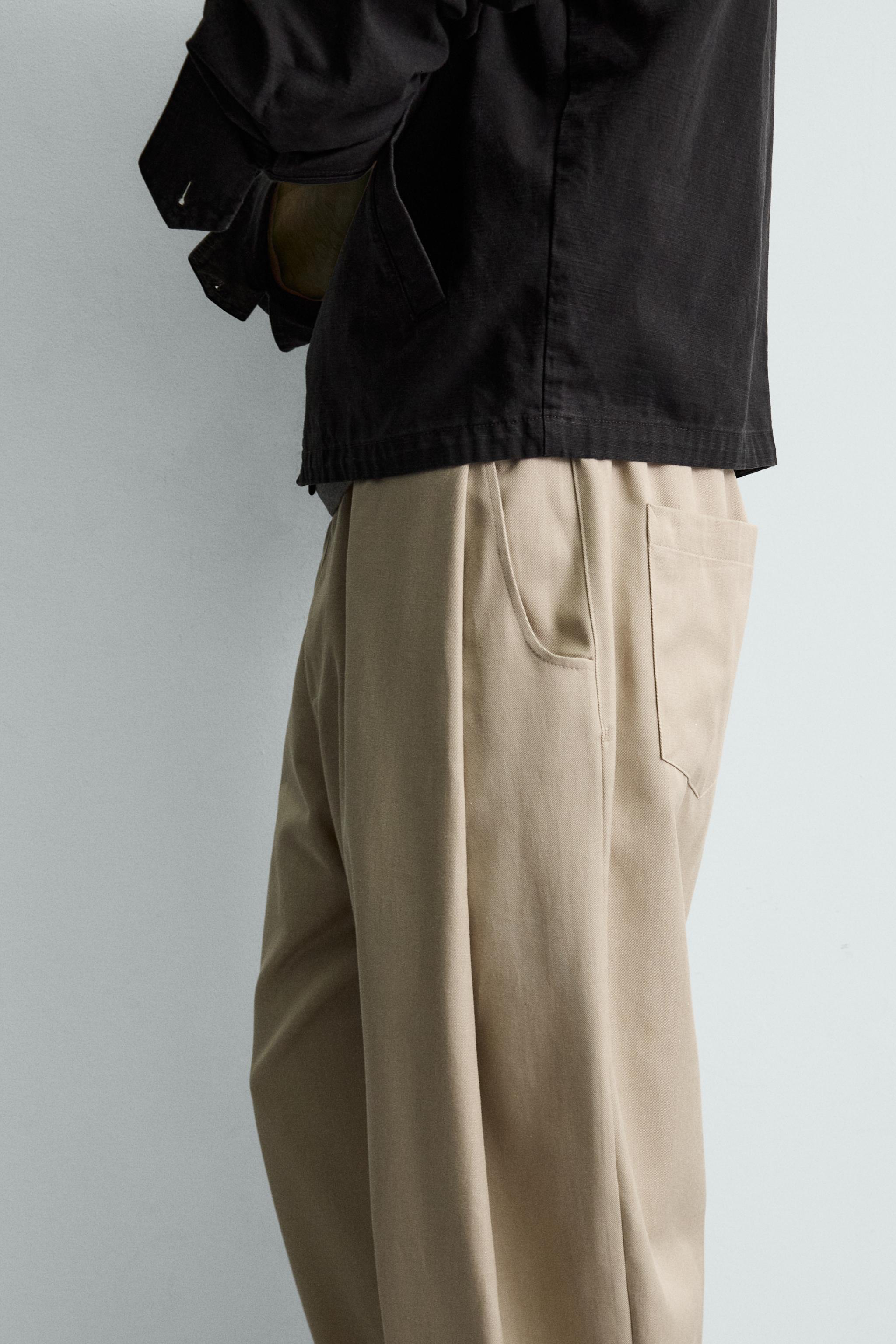 PLEATED BALLOON FIT PANTS